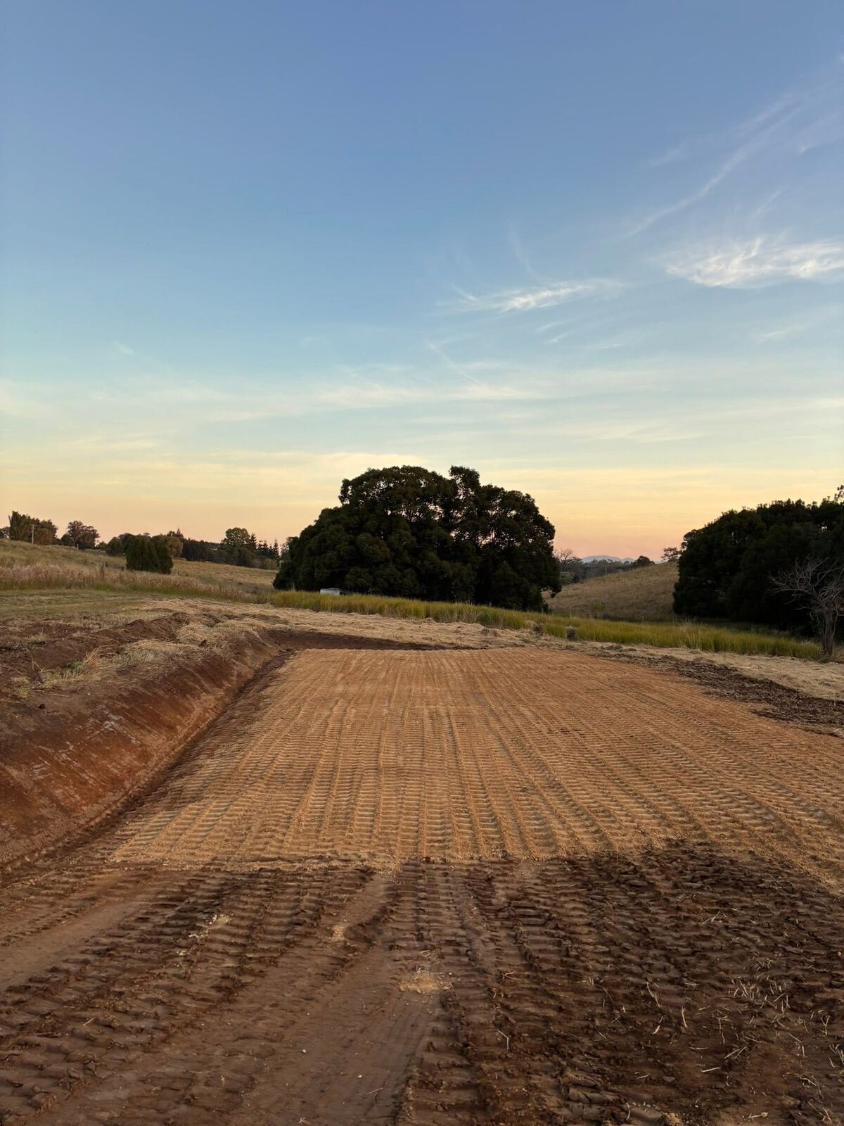 Graded driveway at sunset