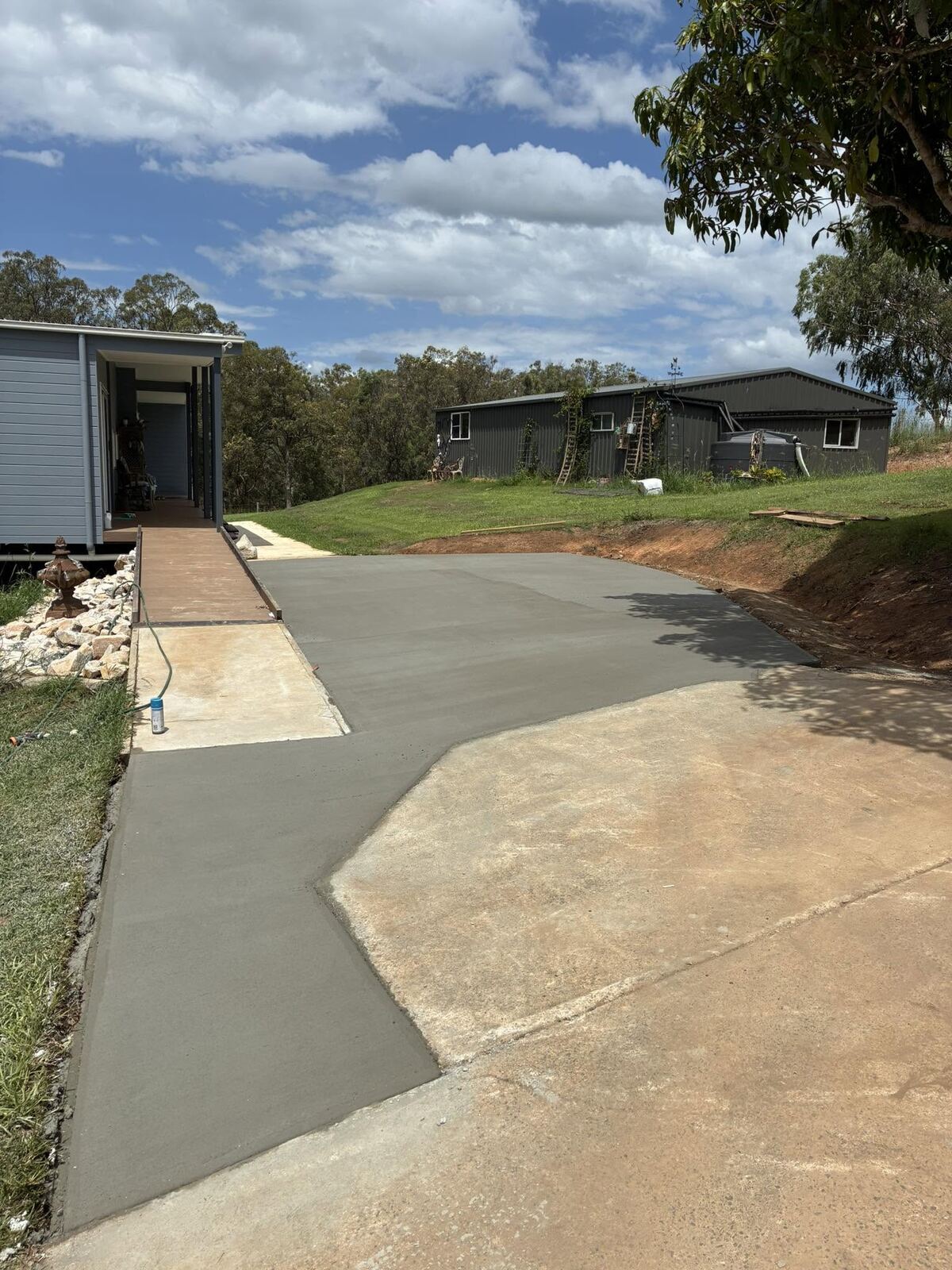 Retaining wall behind water tank